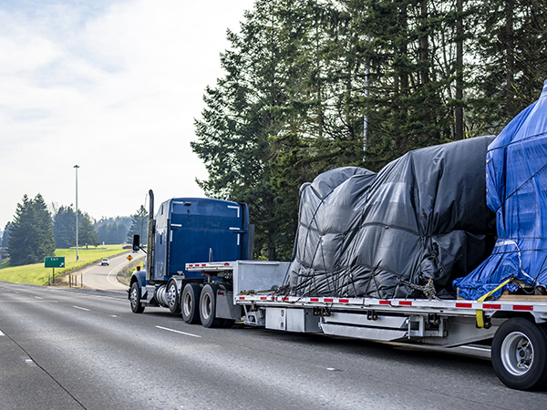 Blue flatbed semi truck
