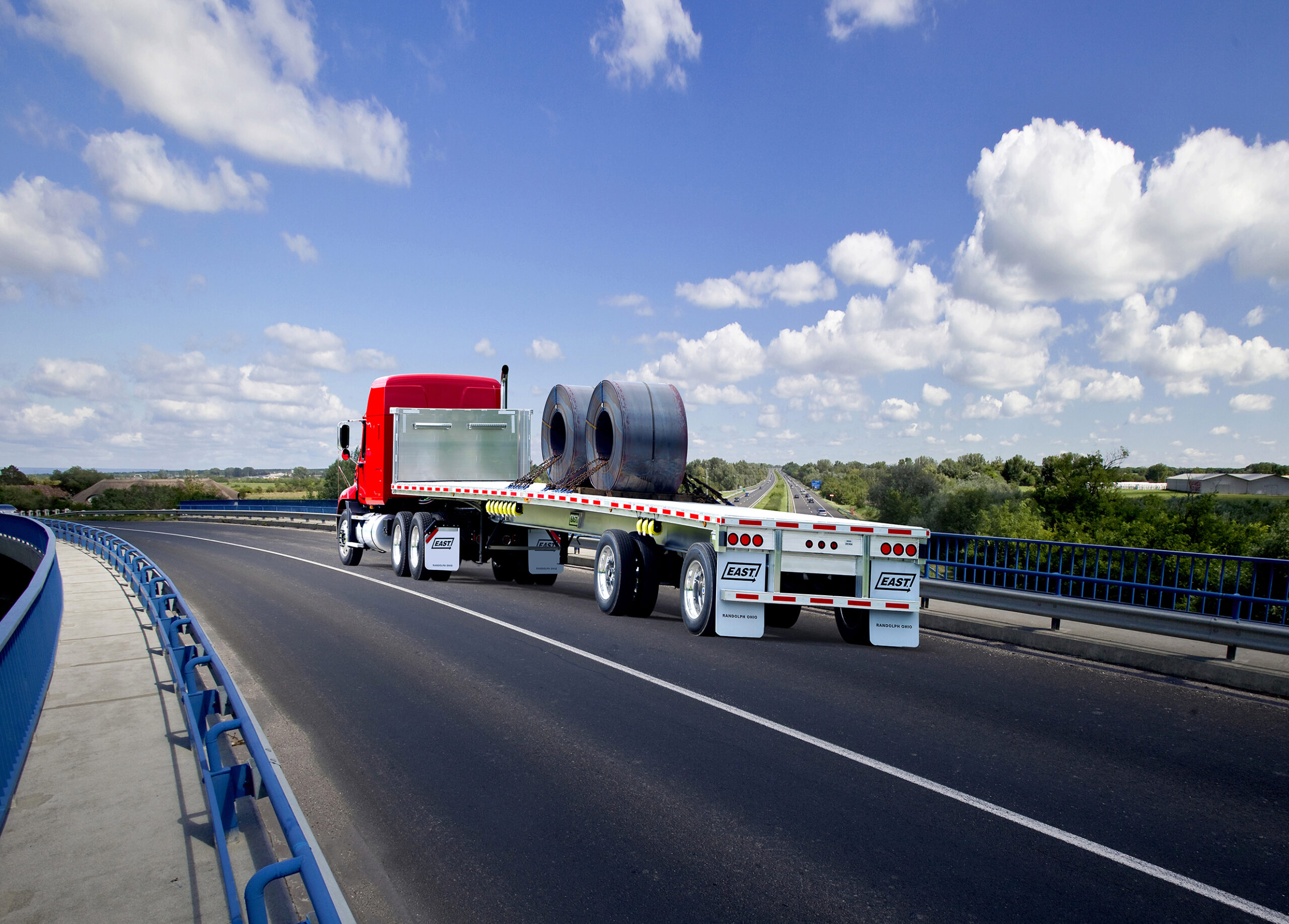 Flatbed trailer hauling steel coils